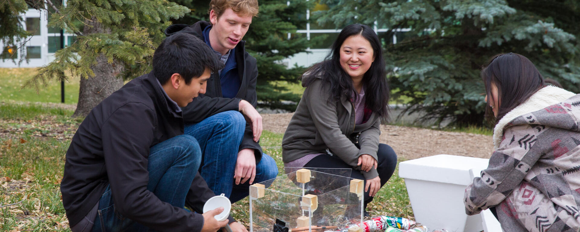 Students doing research outside.