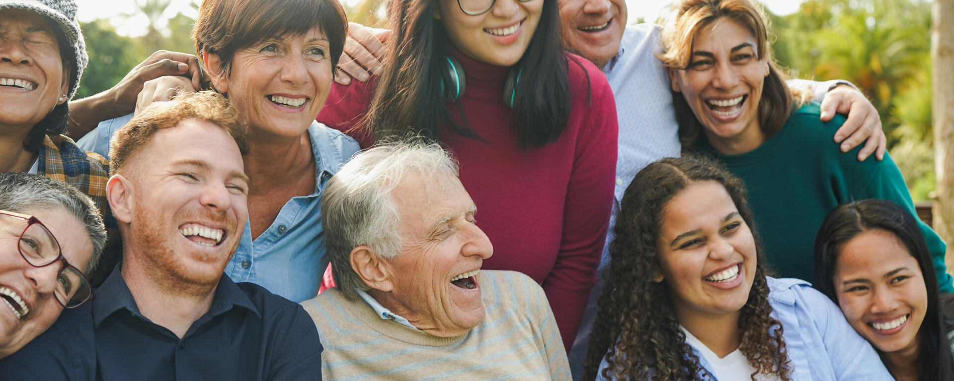 group of people of all ages laughing together 