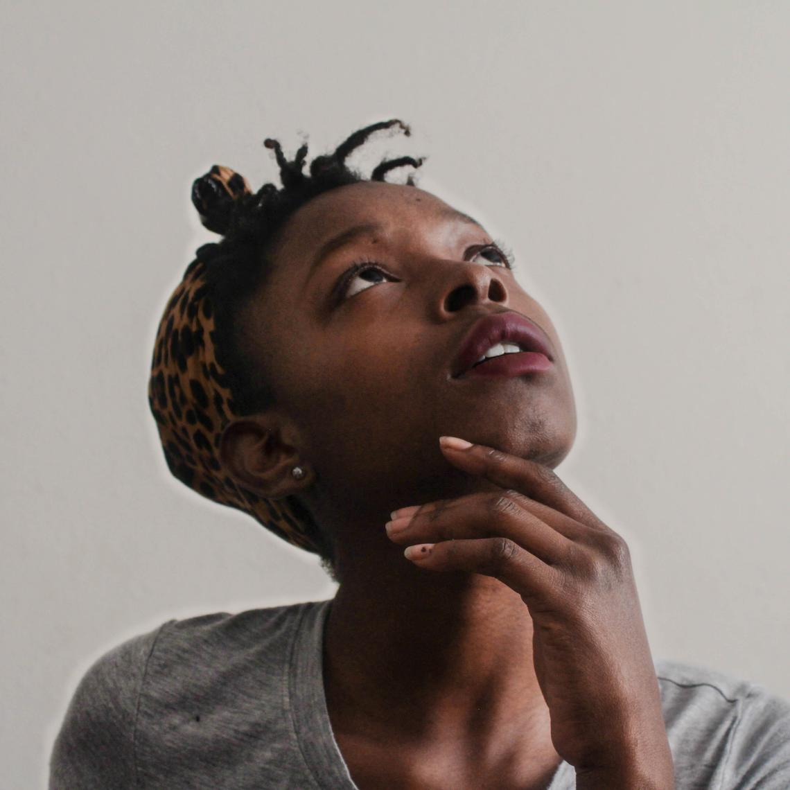 Quizzical looking young black woman