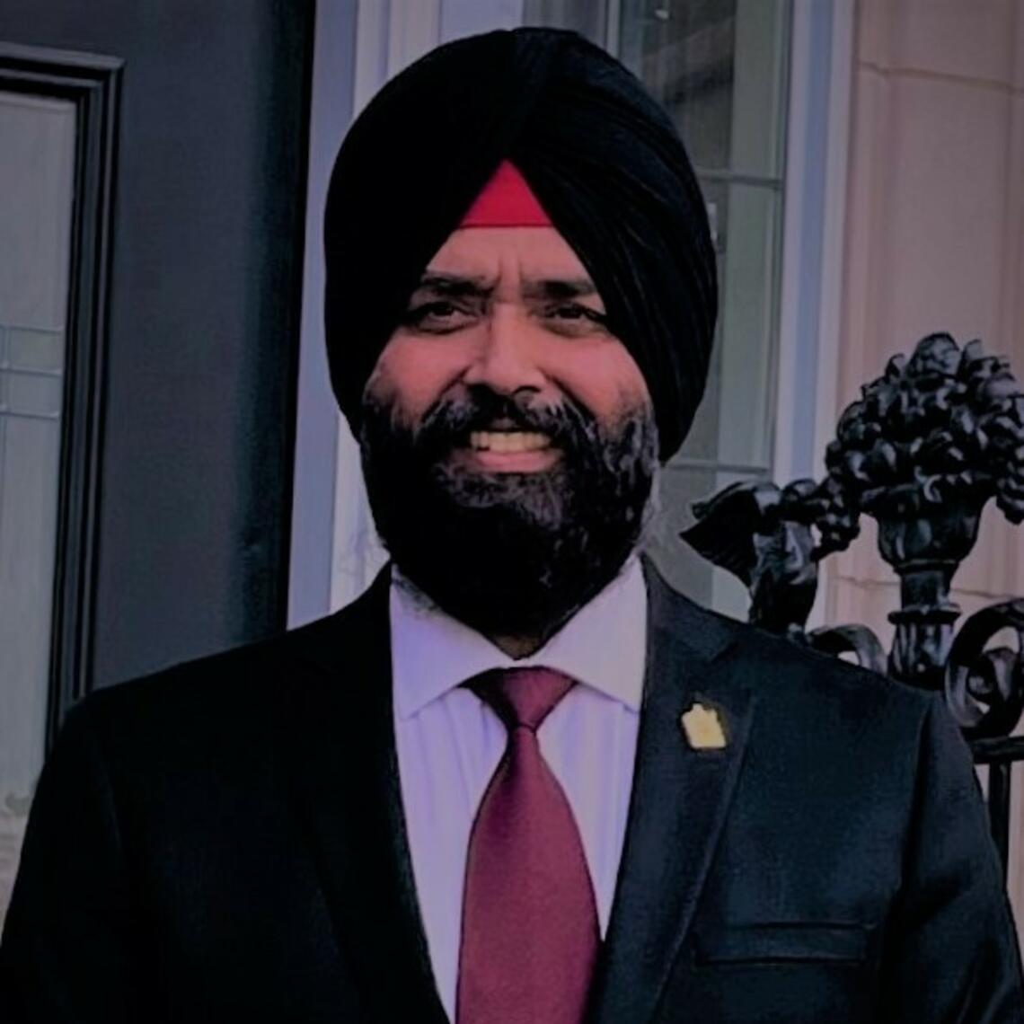 Karan Chamal Singh Dullat smiling at the camera