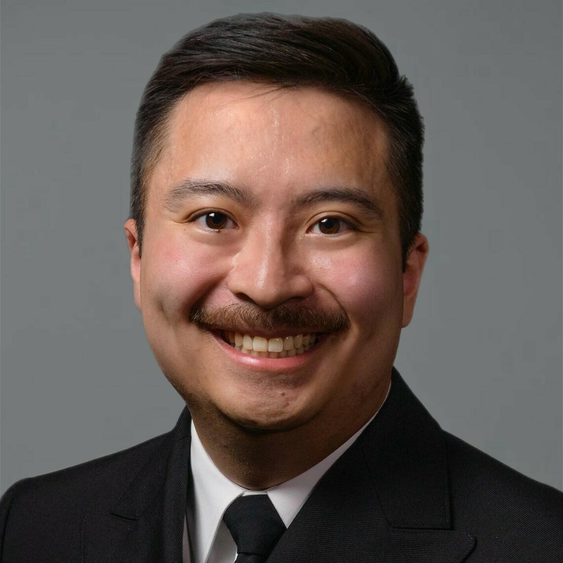 Timothy wun smiling at the camera