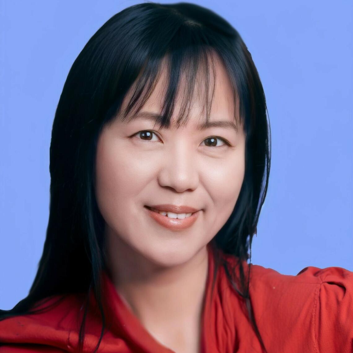 May Han smiling a the camera