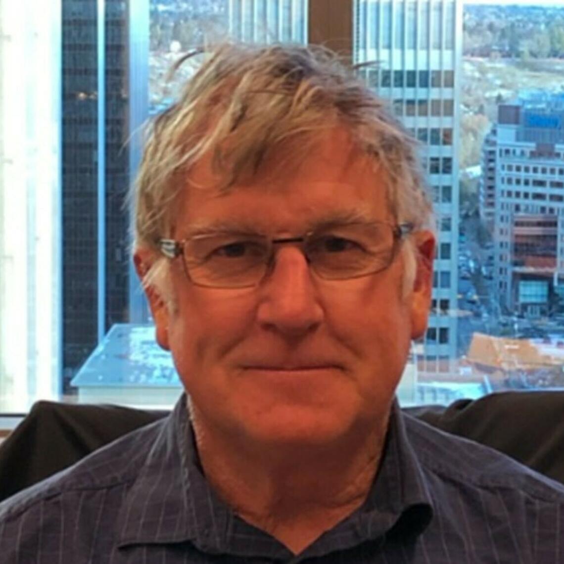 Richard Baker smiling at the camera