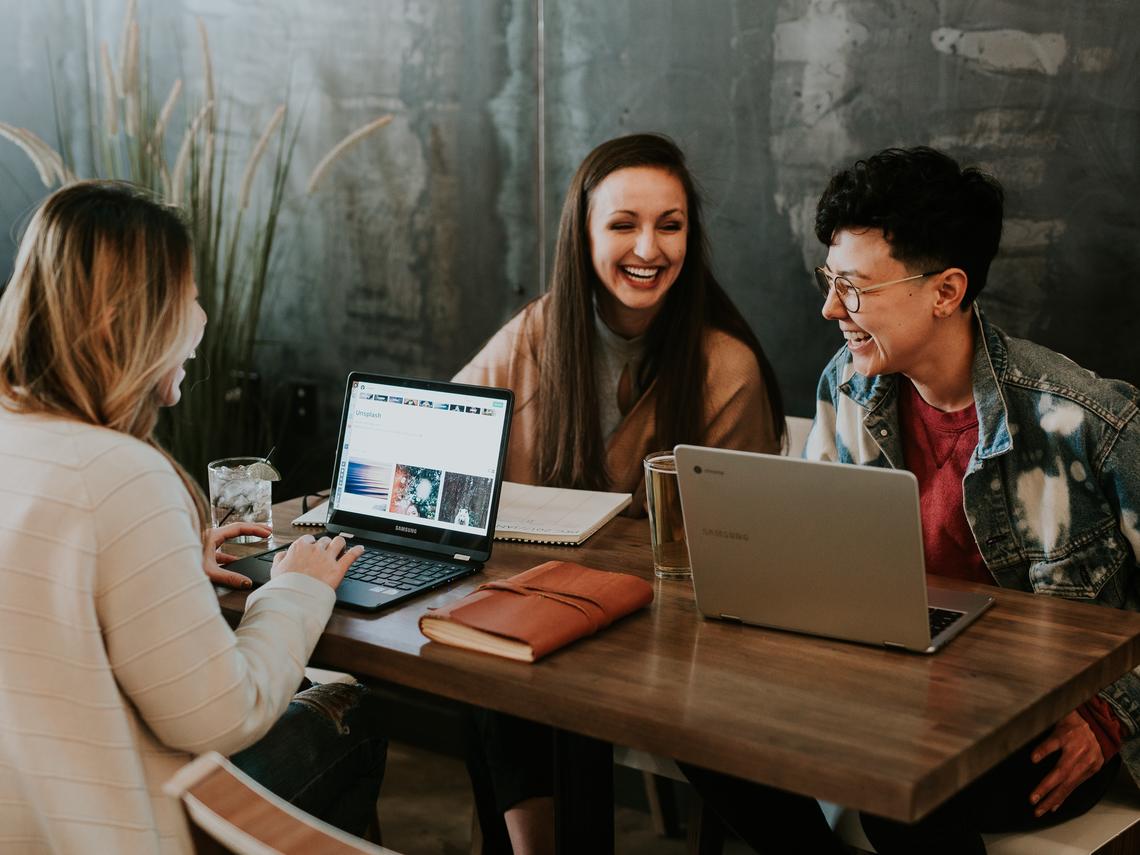 Students laughing and working, Photo by Brooke Cagle on Unsplash