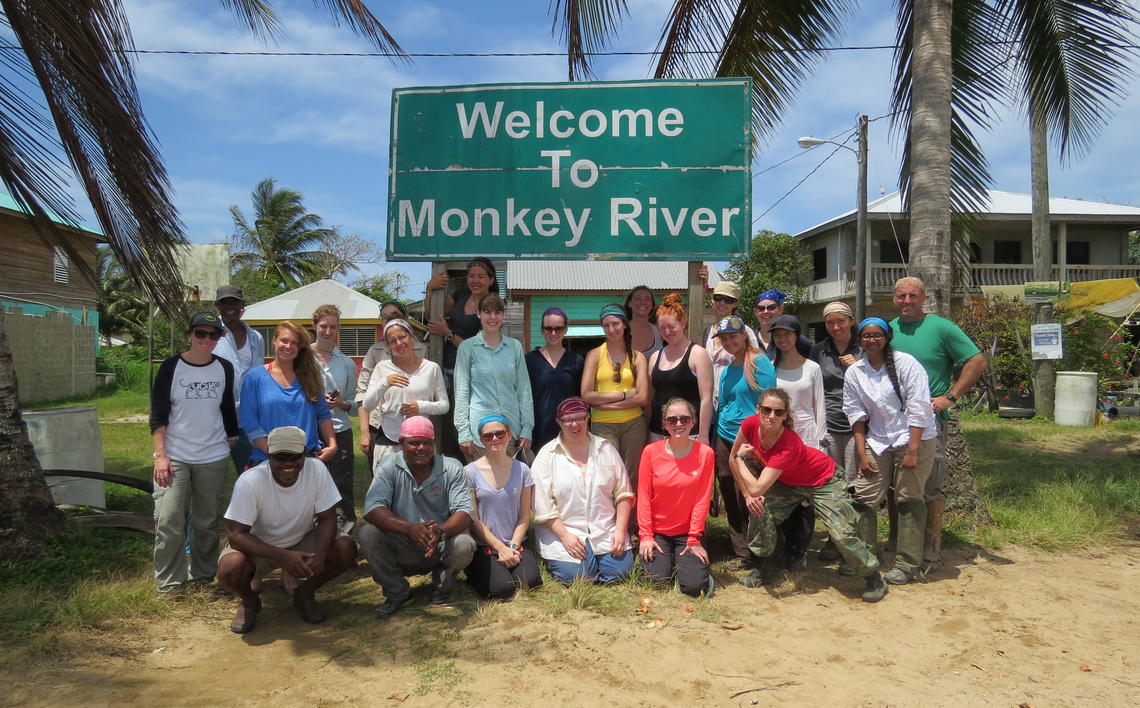 image of field school students at Welcome To Monkey River signpost