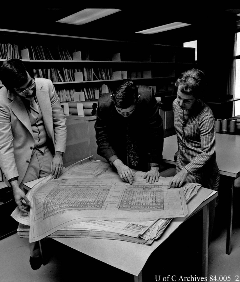 Image of (L to r) Ernie Ingles, librarian; Dr. Michael McMordie, EVDS; Annalise K. Walker, curator, Canadian Architectural Archives; examining documents, October 1977.
