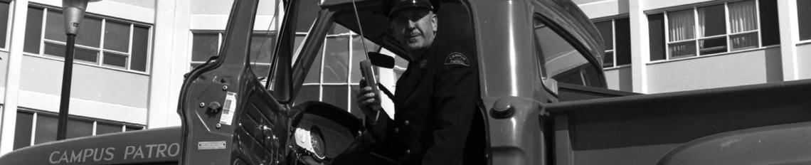 Image of Campus Patrol Chief Verne Teeple with the Campus Patrol truck Image of Campus Patrol Chief Verne Teeple with the Campus Patrol truck