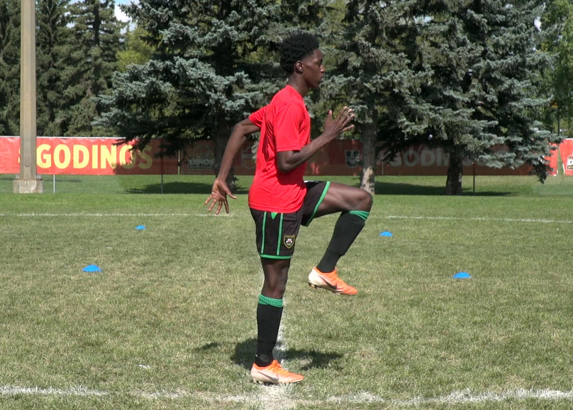 Soccer player performing high knees