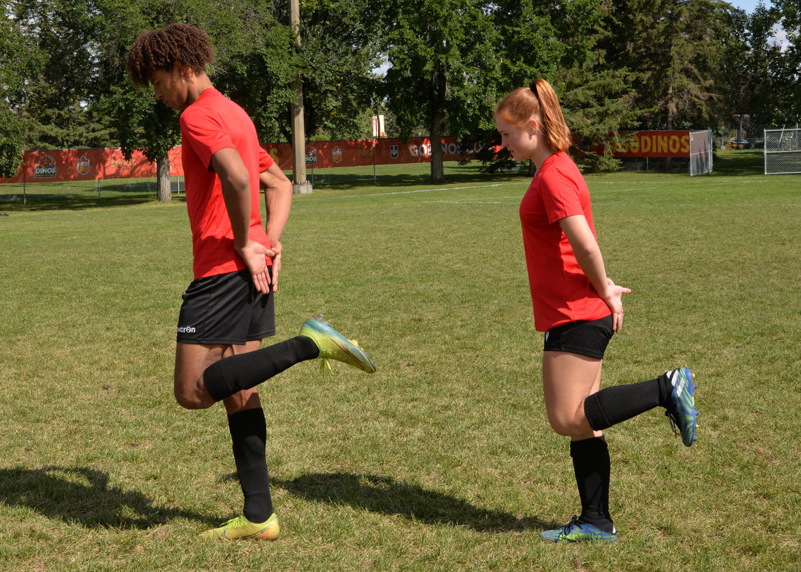 Soccer athletes performing heel kicks