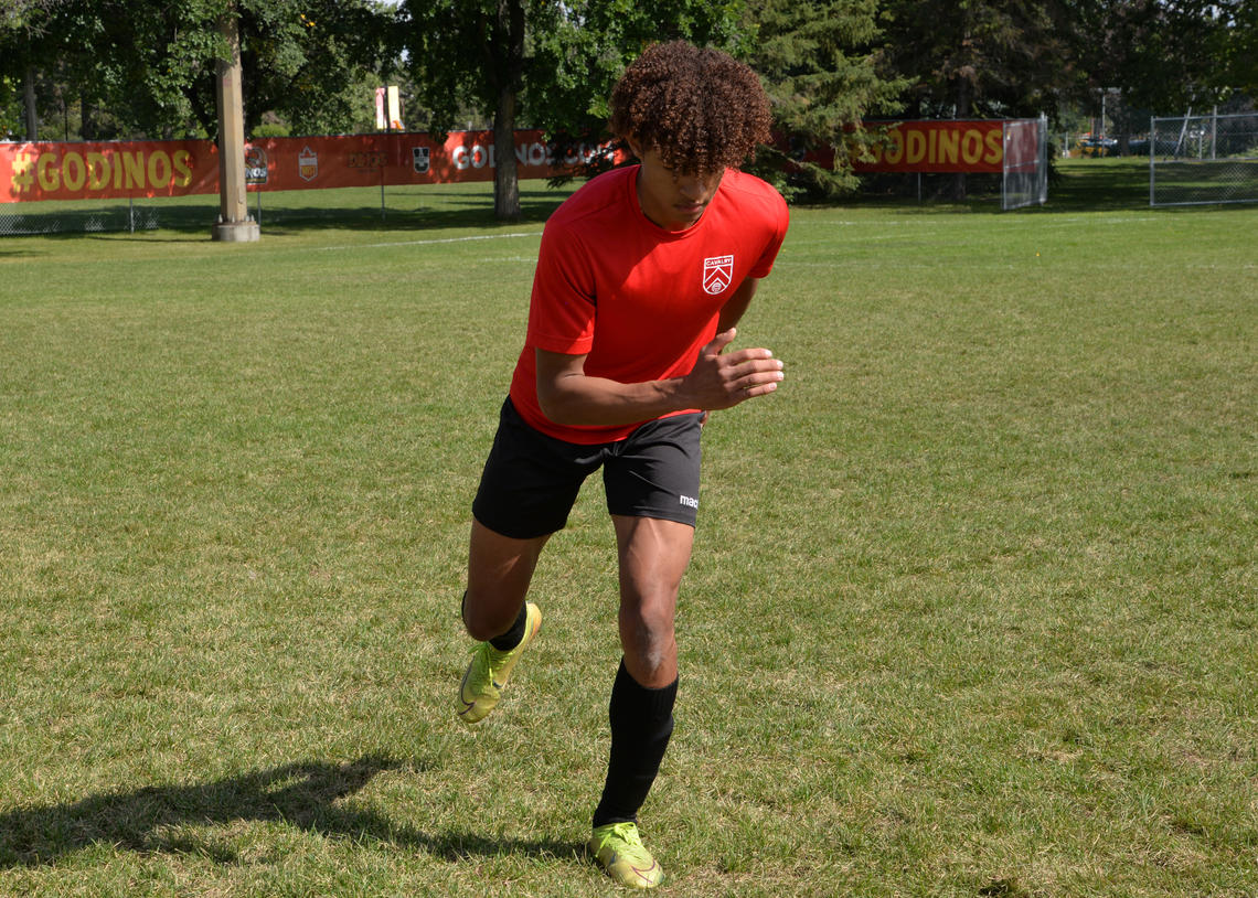 Soccer athlete performing a skate jump