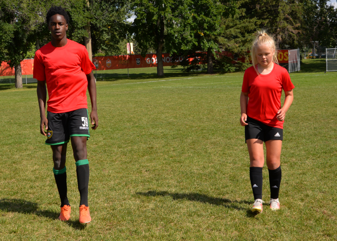 Soccer players performing ankle pops exercise