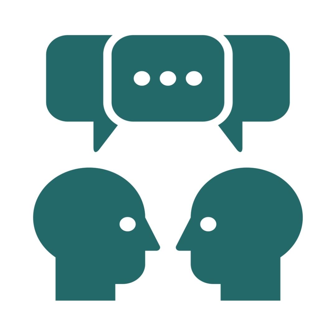 Icon of two heads talking with a speech bubble above them.