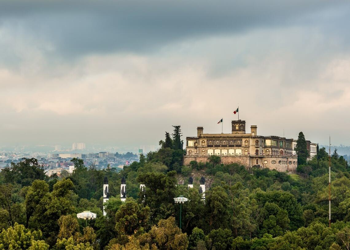 Palace on a hill surrounded by trees