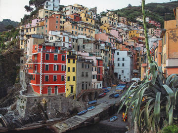 Image of colourful houses stacked along steep cliff