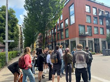 Students gathered on city street corner