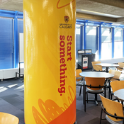 Large pillar completely wrapped in Start something graphics