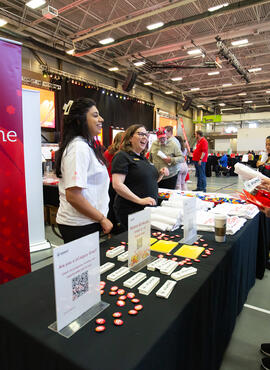 Group of people at a showcase table