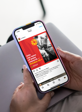 Person holding a phone looking at social media