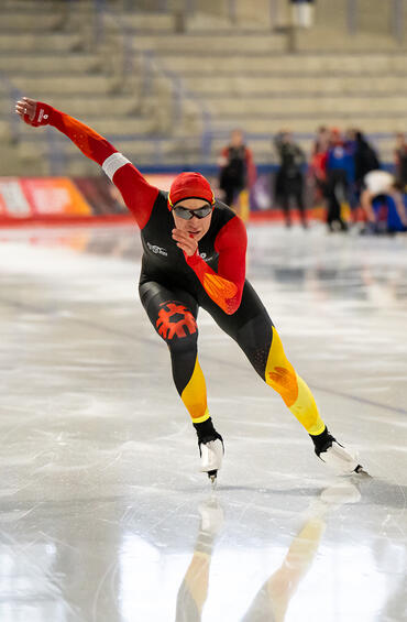 Speed skater in new UCalgary suit