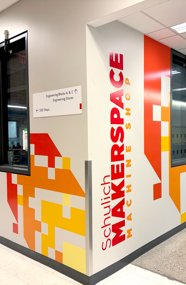 A hallway with colourful wall graphics