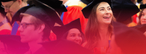 Text overtop of a crowd of graduates