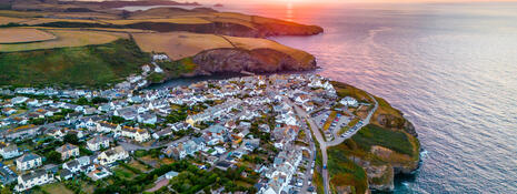 Aerial view of a coastal town at sunrise