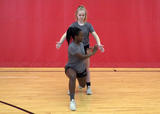 Athletes performing stationary lunge with partner claps exercise