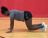 Rugby athlete performing Stationary Bear Crawl Neutral Neck Hold exercise
