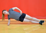 Athlete performing side plank exercise