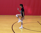 Athlete performing airplane balance t-walk exercise