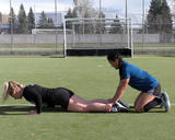 Athlete performing nordic hamstring curl with push-up