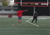 Football athletes performing partner plant and cut
