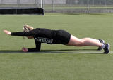 Athlete performing front plank with arm lift