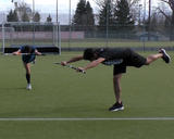 Athletes performing high knee to superman balance