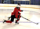 Hockey players performing lunges on a hockey rink