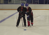 Ringette players performing shoulder to shoulder skate with passing exercise on a rink