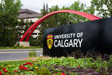 UCalgary sign in front of arch, campus entrance