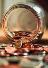 coins spilling out of a jar