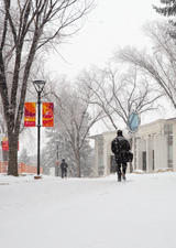 students walking on a snowy main UCalgary campus