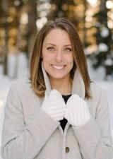 A portrait photograph of Kate Hamilton outside in the snowy forest