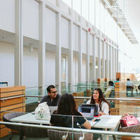 People sit around a table inside the Taylor Institute for Teaching and Learning.