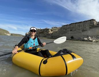 Eva in a packraft