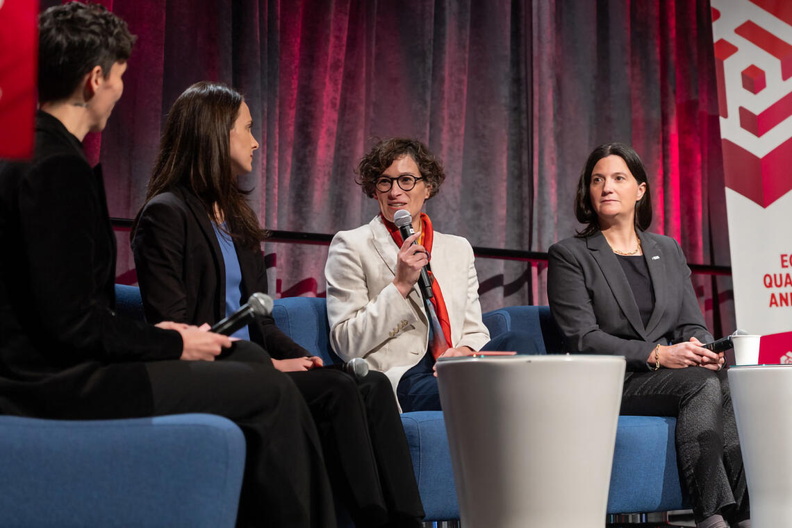 A group of people sit on a couch