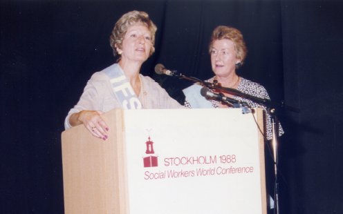 Gayle at Podium with
                  Former President, Augusta McCabe